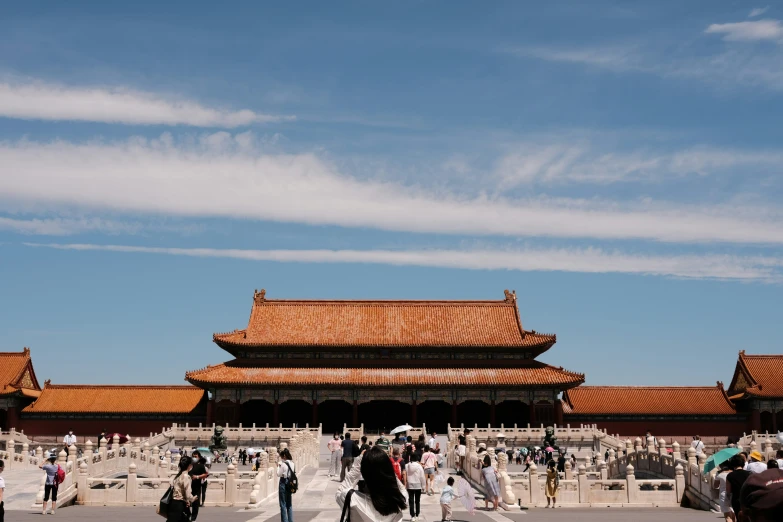 a long building with an open courtyard in front of it