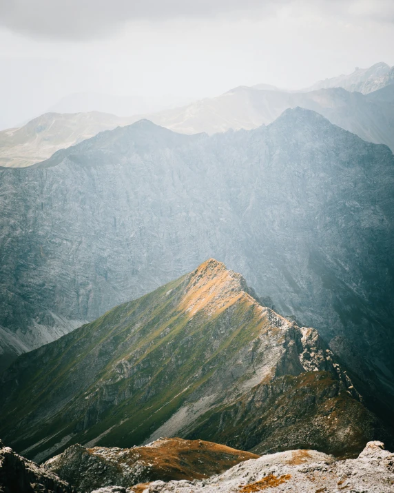 the view from top of a mountain of mountain peaks