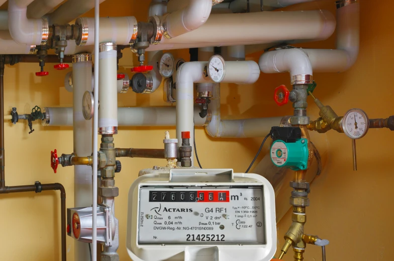 a boiler panel with gauges and other pipes