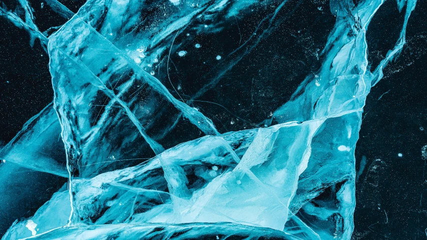 a black background with blue ice, which has various shapes and sizes