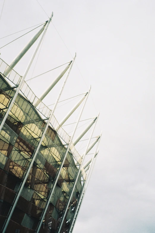 a white and gray building with glass on top