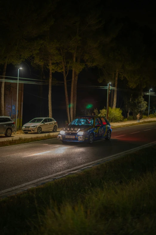 cars on the road in front of a police station