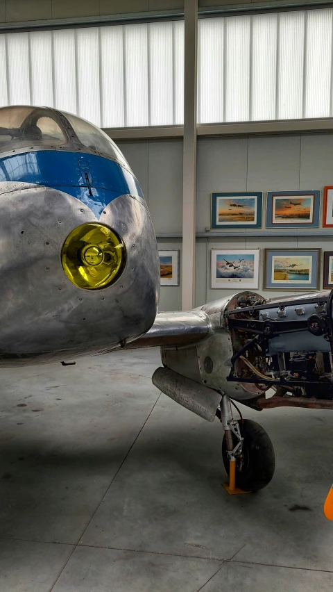 the old airplane is being displayed in a museum