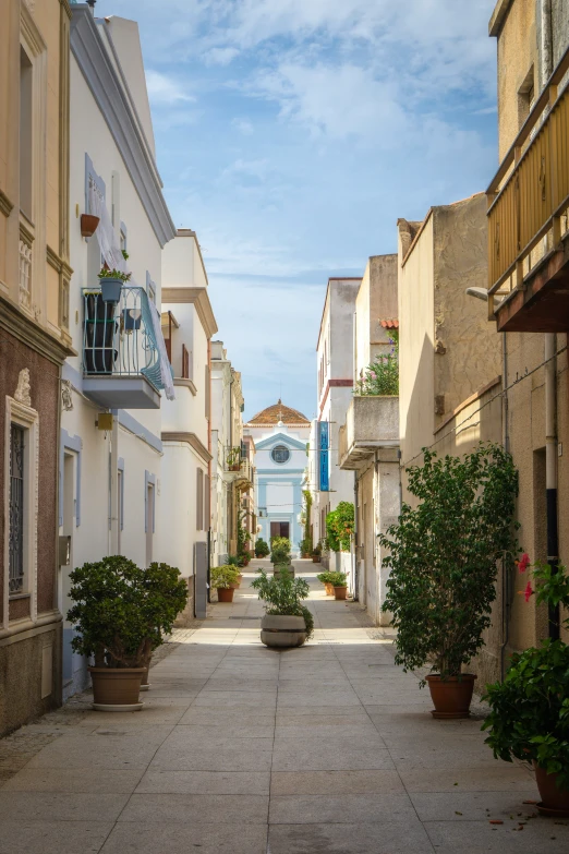 an alley way leads into an urban area