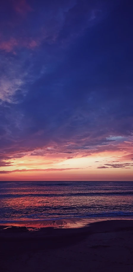 an ocean view at sunset with clouds and water