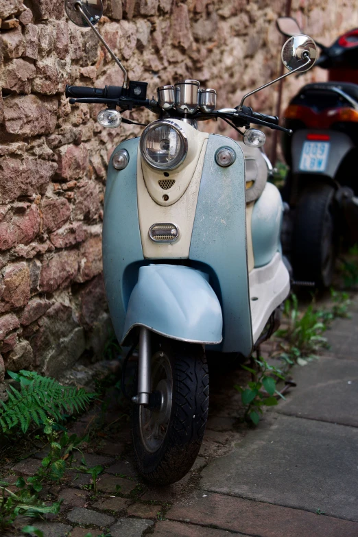 the motorcycle has been painted blue and cream