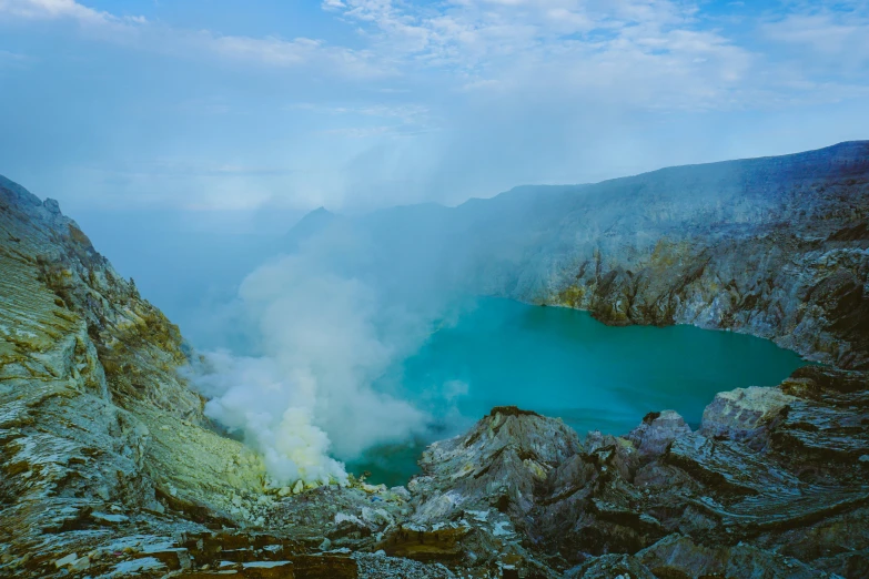 a large crater surrounded by a body of water