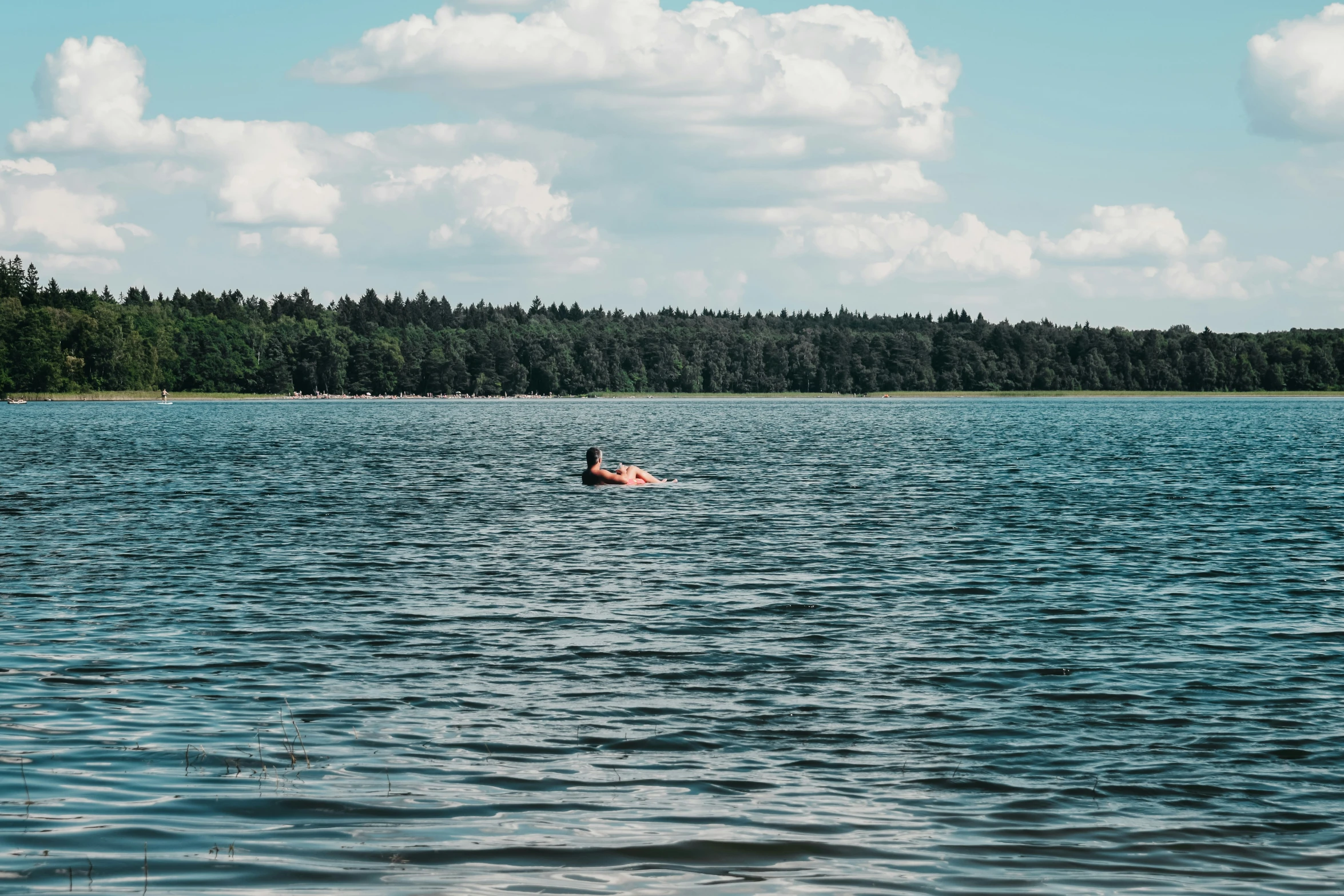 there is a person in the middle of the water