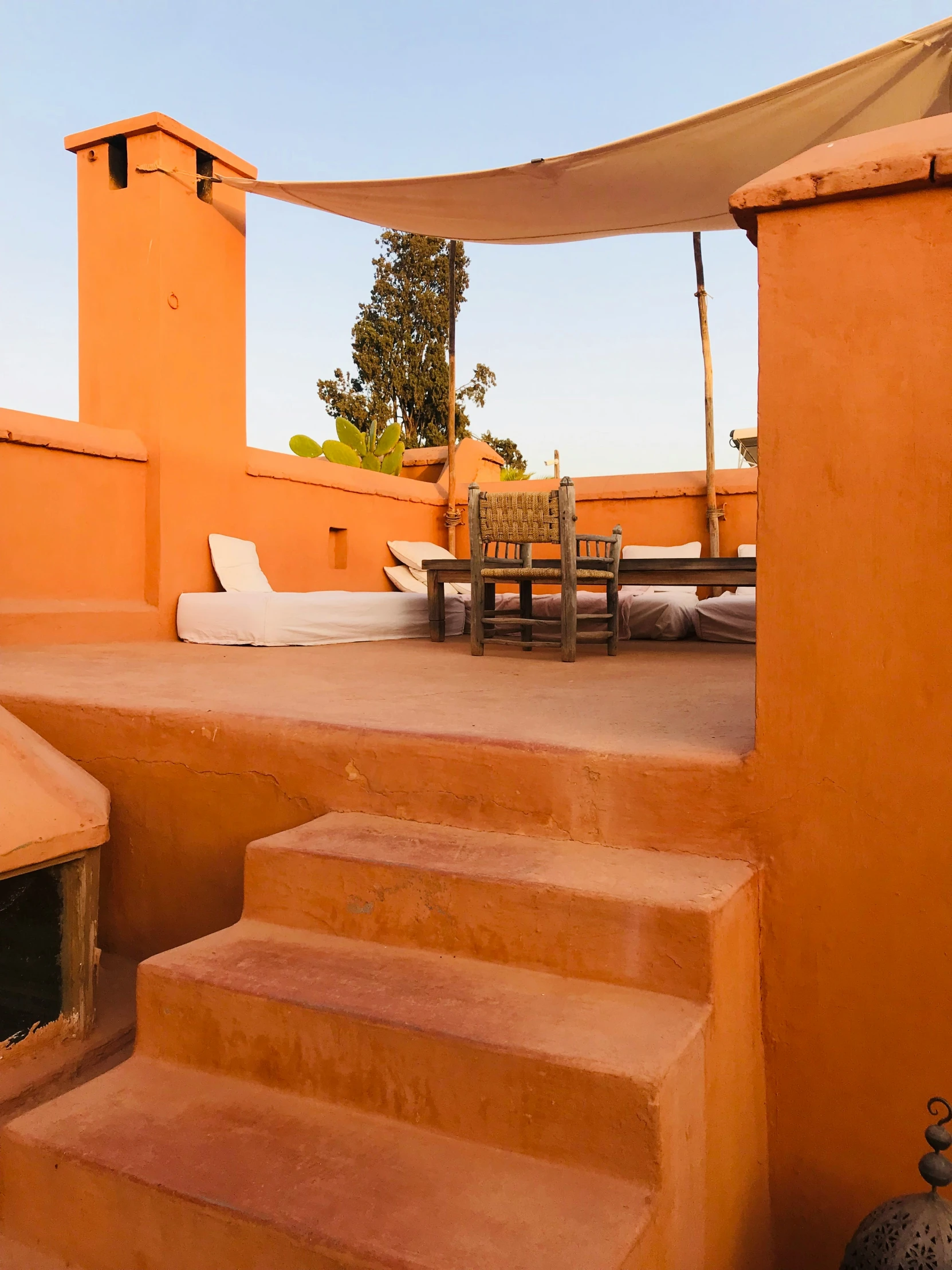 stairs leading to an outdoor patio with seating