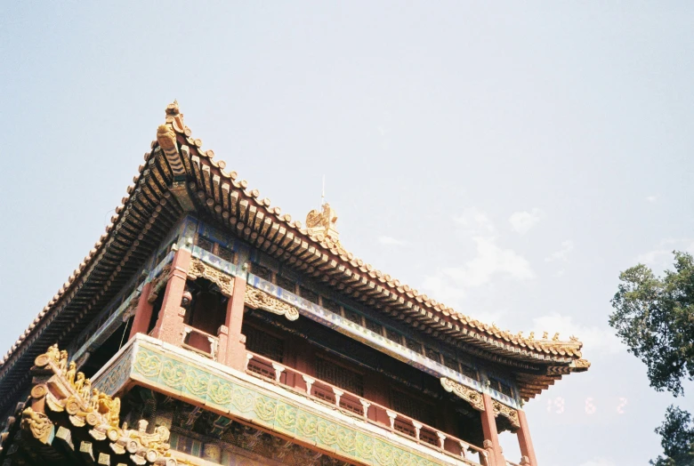 an ornate building is depicted against a bright blue sky