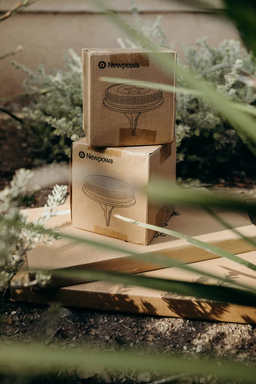 two boxes on top of a wooden board