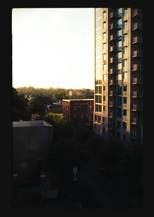 view from room in el with tall building in foreground