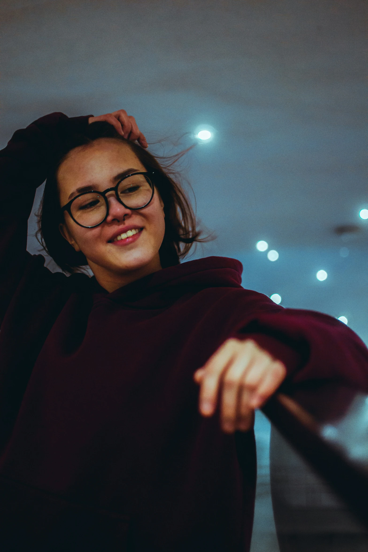 a woman posing for a picture with her arms spread