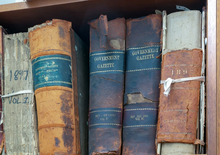 books on a shelf and a book bag