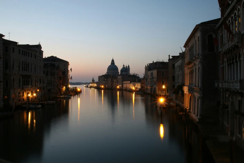 a river that has some buildings on the side of it