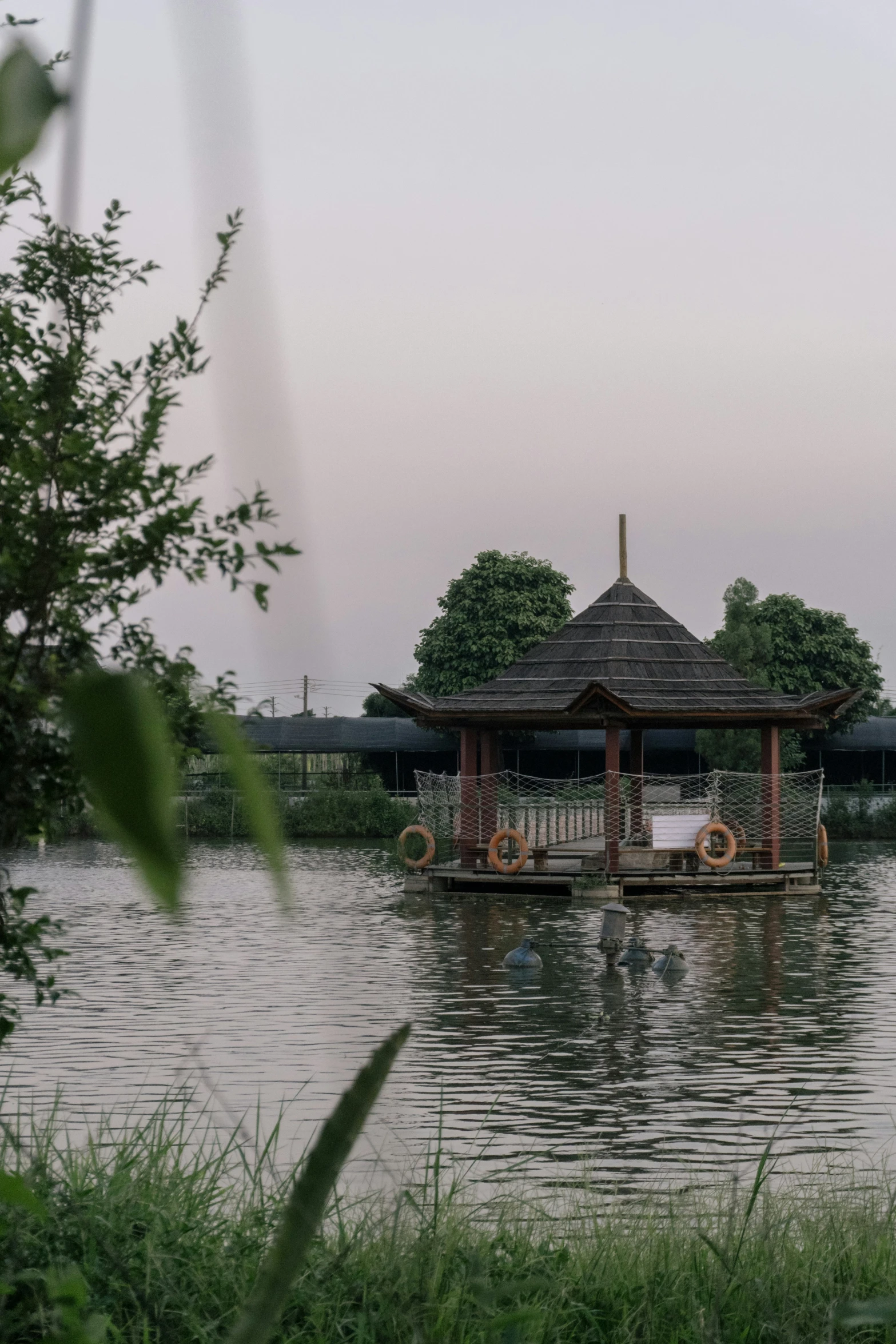 a dock with some tables in the water