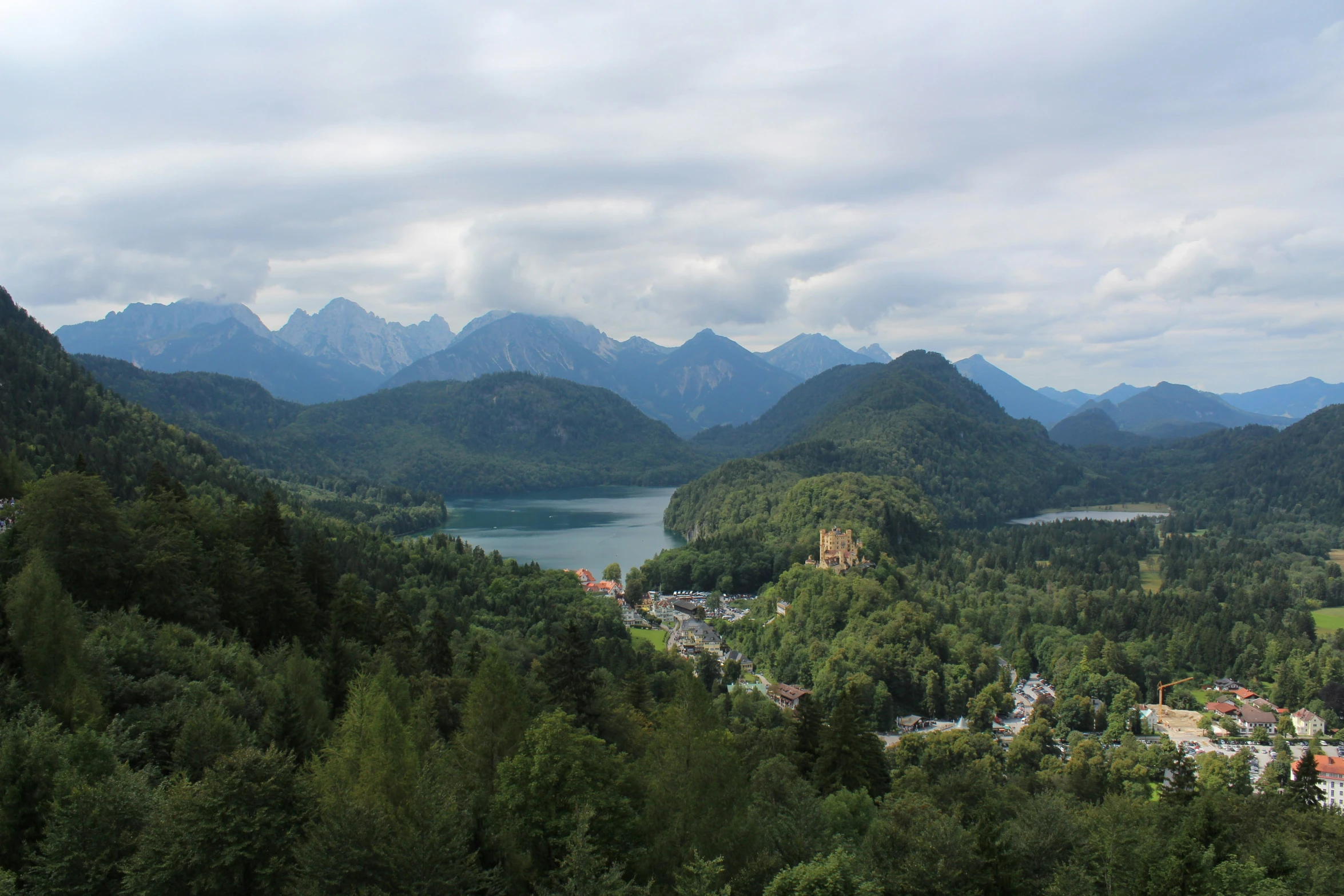 view of some mountains, the town and some lake