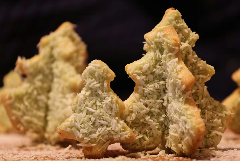 a number of pastries on a surface with other food items