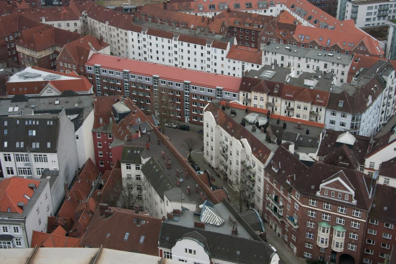 many large white buildings and red roof tops