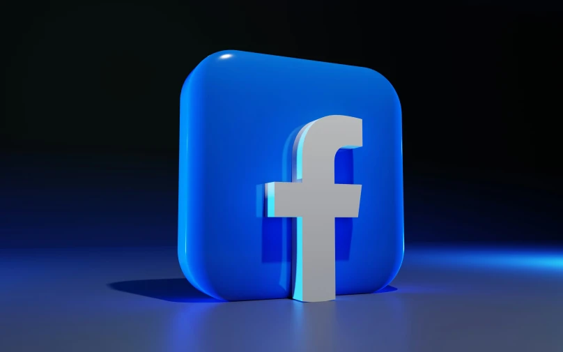 a blue and white facebook symbol with a black background