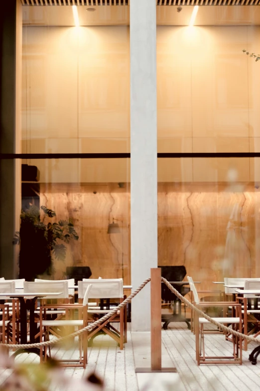 an empty building with many benches and tables