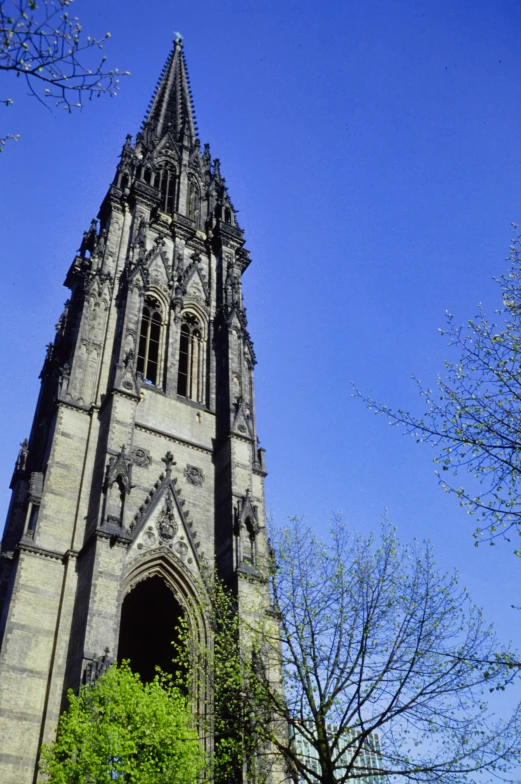 a church with a large spire in the middle