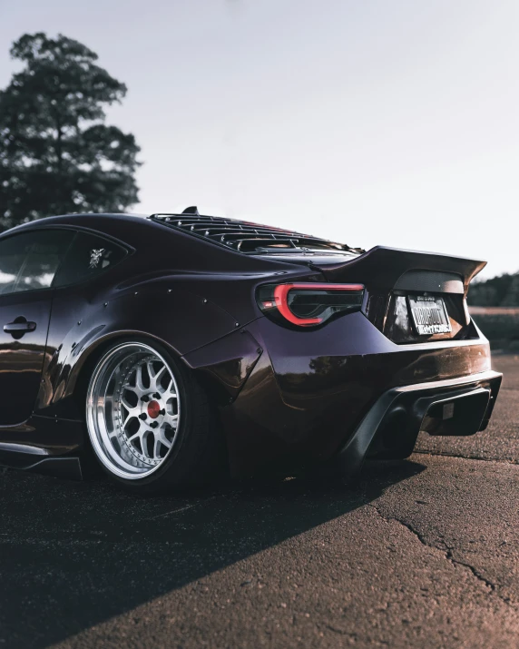 a black sports car parked on a street