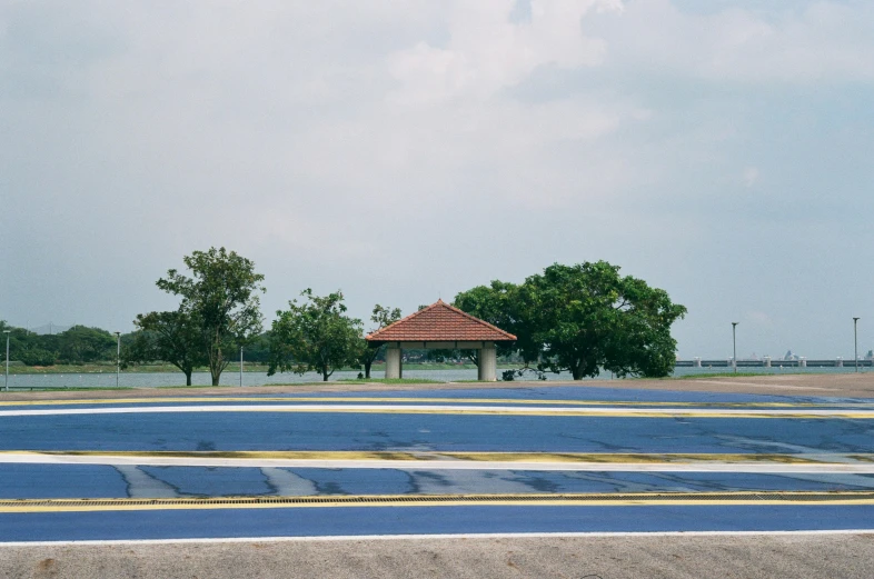 an empty blue and white striped parking lot