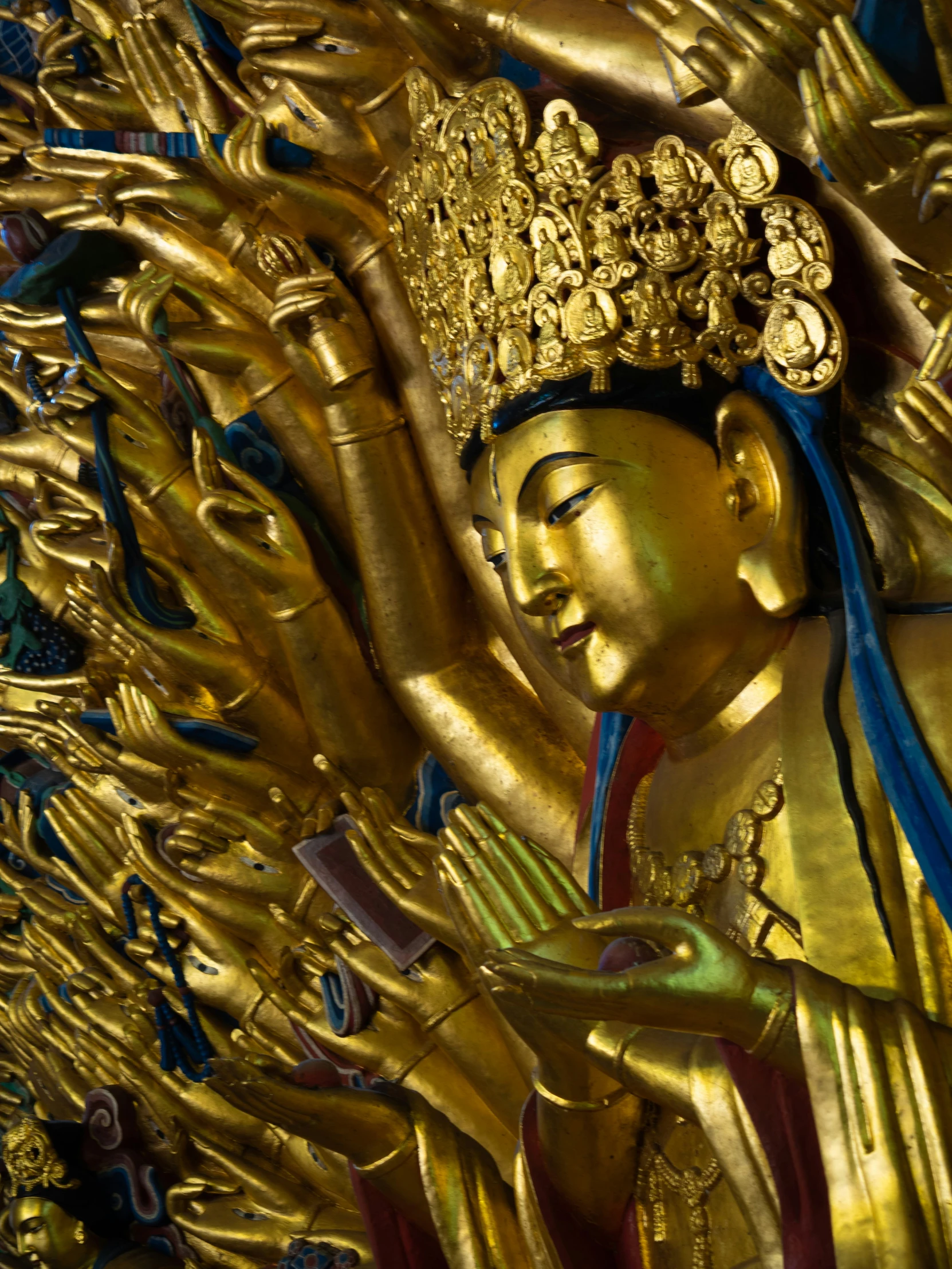 the statue is painted in gold and blue