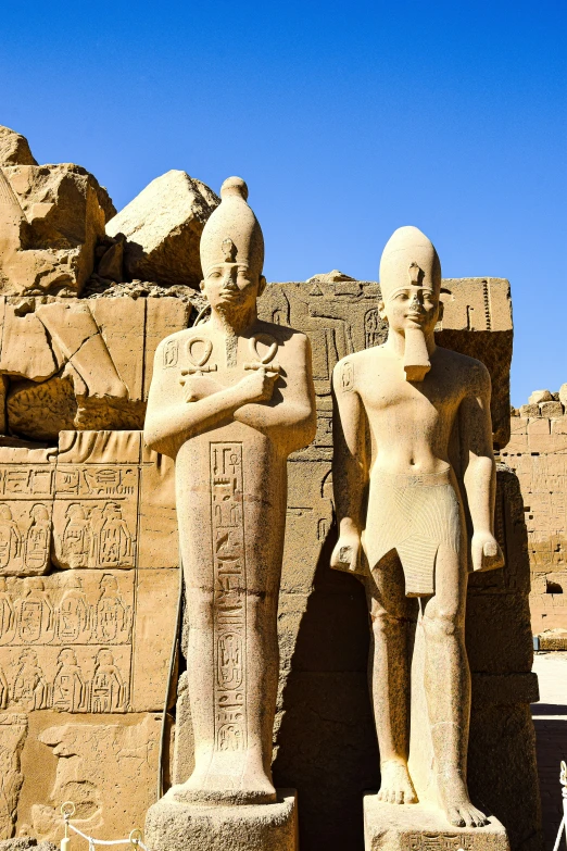 egyptian statues in front of the entrance to a temple at abut abut