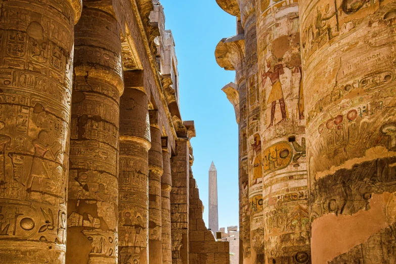 an old street lined with stone and painted stone columns