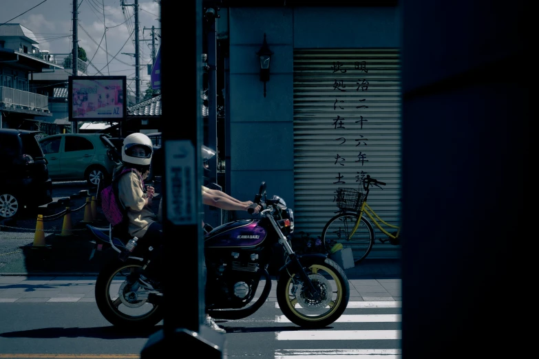 two people on motorcycles ride past each other