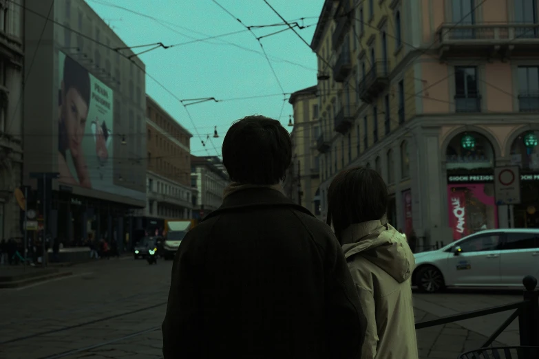 two people looking down an alley way at soing