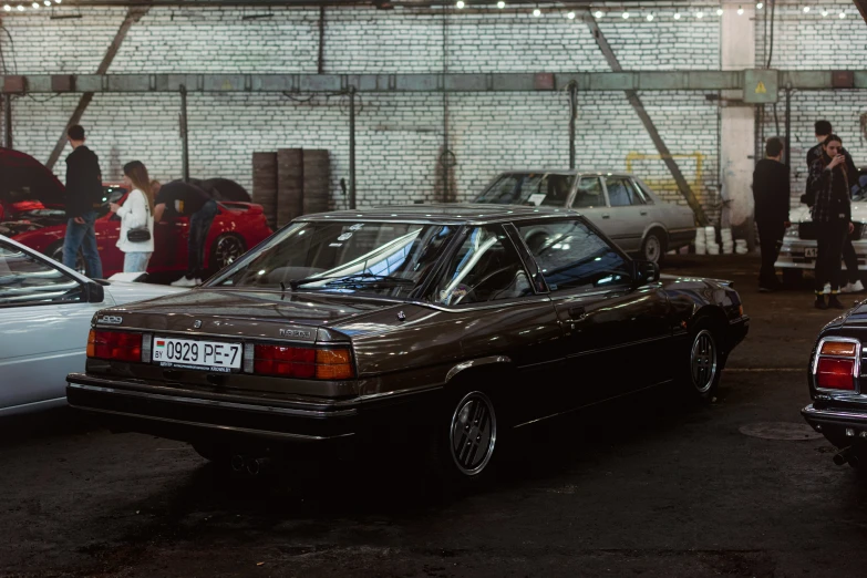 many cars in a car washroom lined up