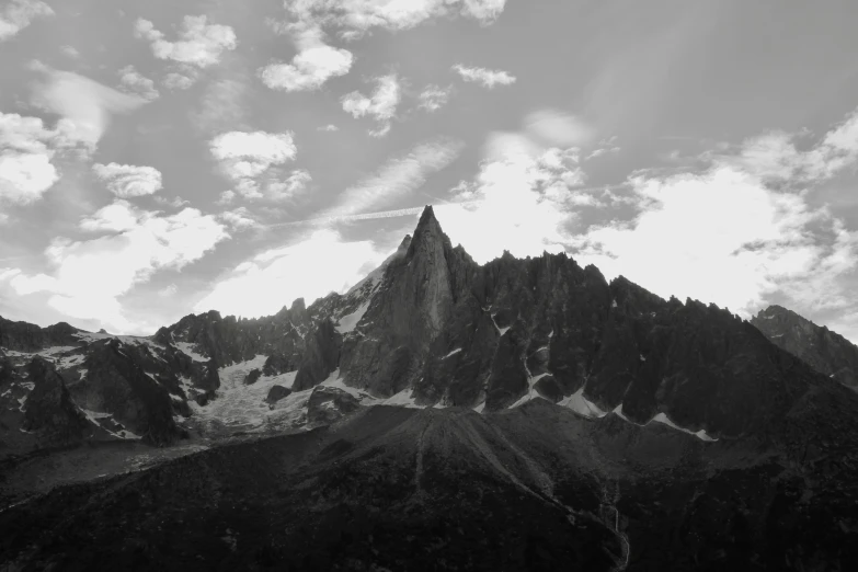 the top of a mountain in black and white