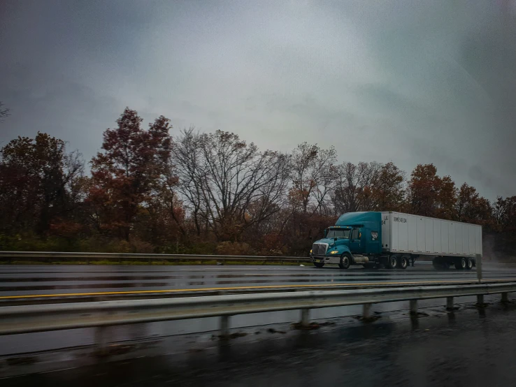 there is a large truck moving down the road