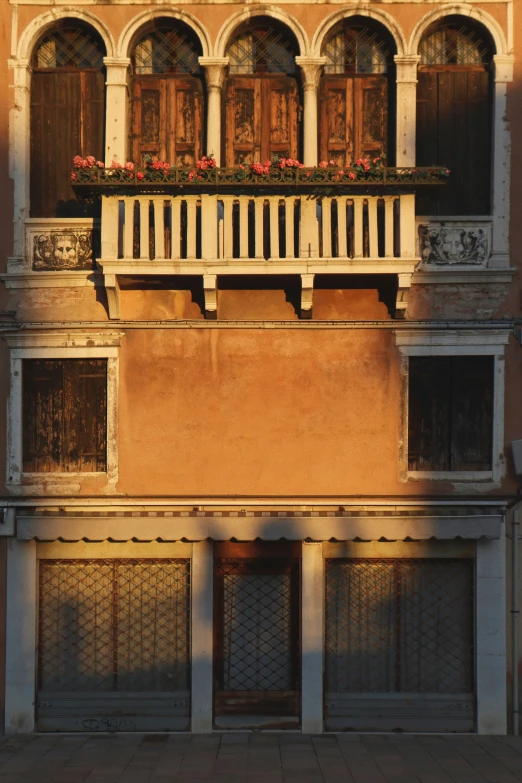 an old building with several balconies and doors