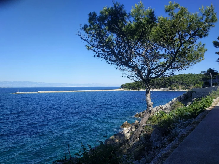 a view of the beach and the water from the shoreline