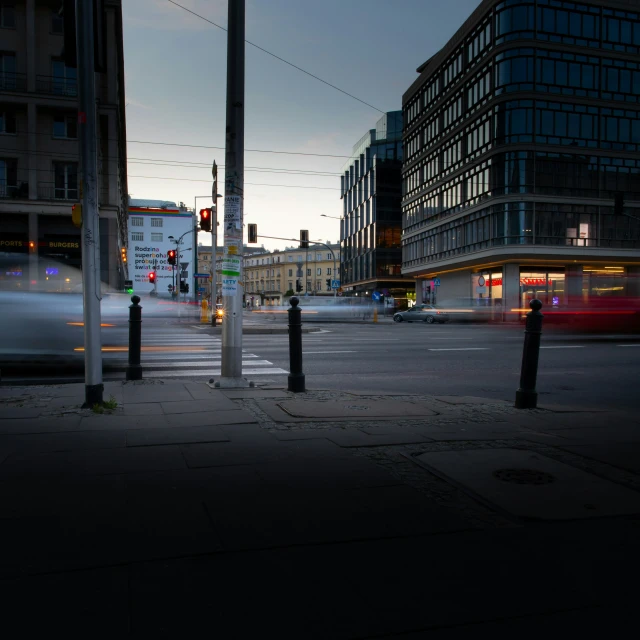 an urban street with many cars moving along