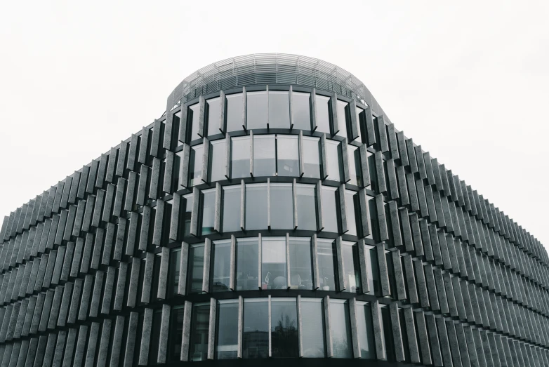 a tall building is shown with a clock on the side