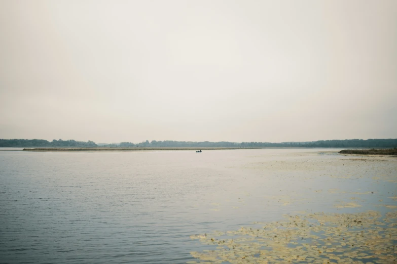 a body of water with many small boats in it