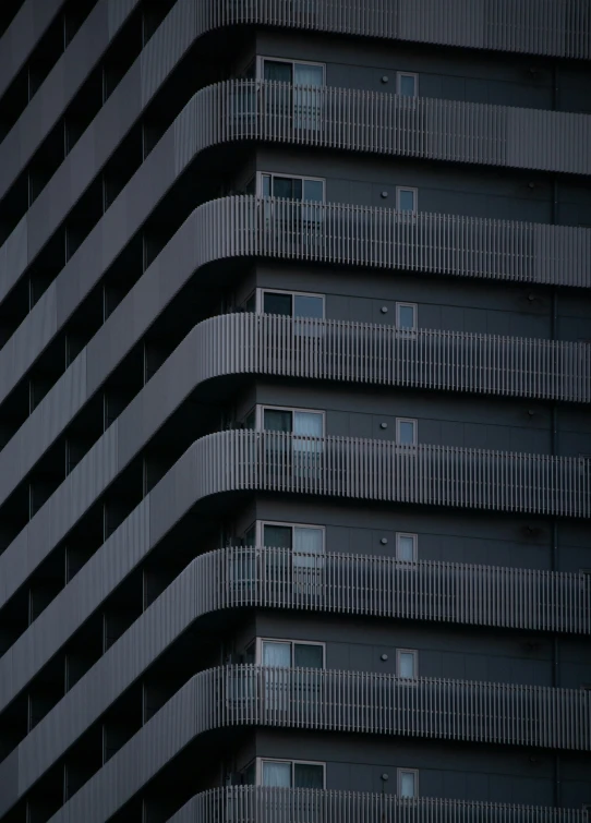 the top half of an apartment building, showing windows