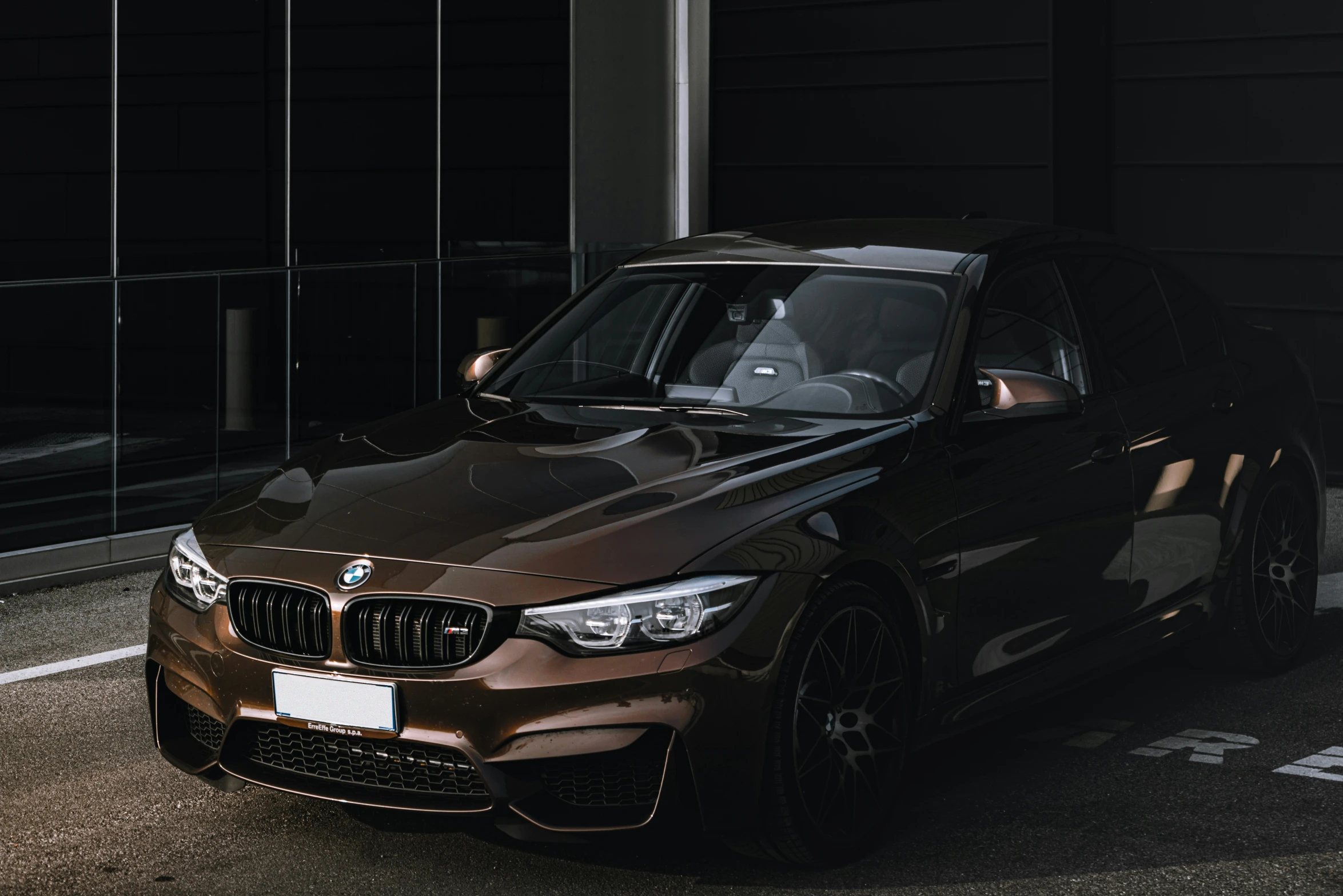 a bmw sports car parked in the parking lot