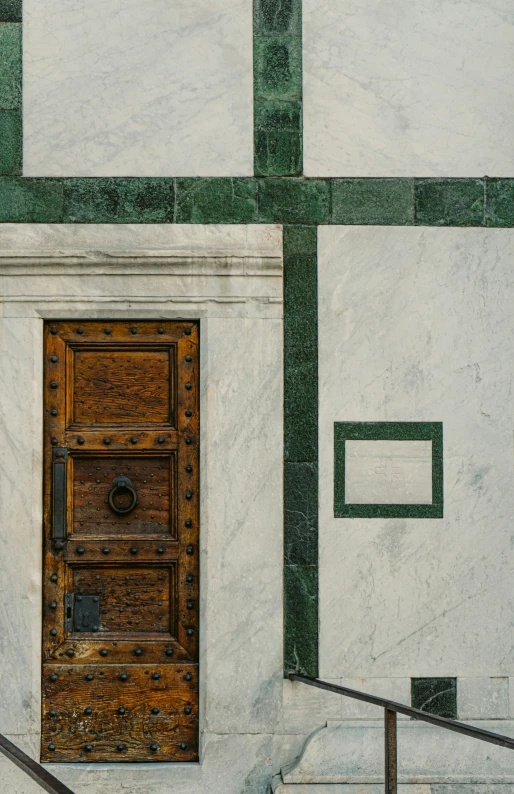 door and railing with large rectangular tile background