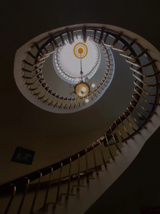 there is a spiral stair case going up in the ceiling