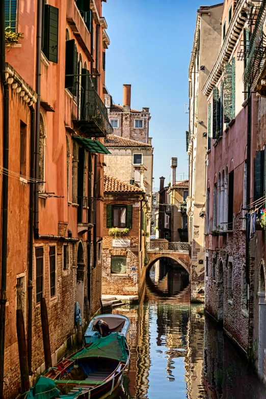 a couple of boats in water near buildings