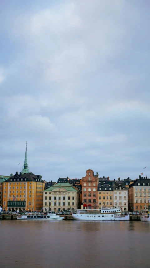 many large buildings with the roofs painted yellow and red