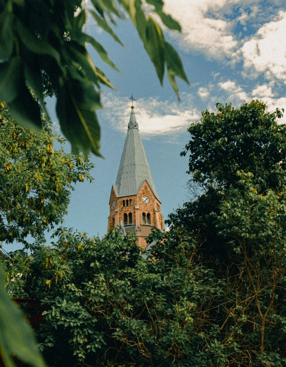 an architectural tower on top of a tree line