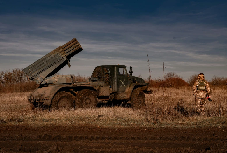 a truck with an uploaded load in a field