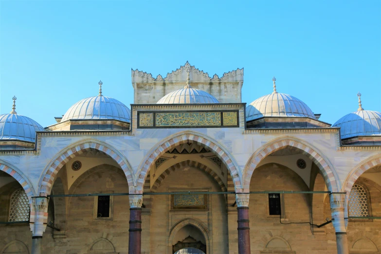 an arched and vaulted building with a statue on the other side